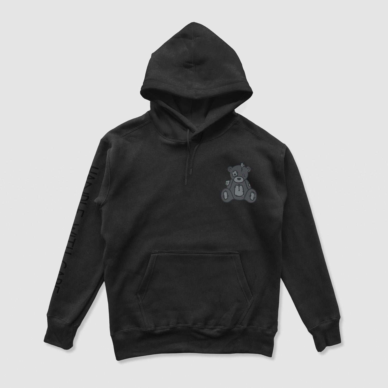 Handle With Care Blackout Hoodie
Our Handle with Care Hoodie feature Patches the Dream Teddy Bear. Patches is a reminder that we're capable of overcoming anything that comes our way. It's a gentleDREAM Clothing