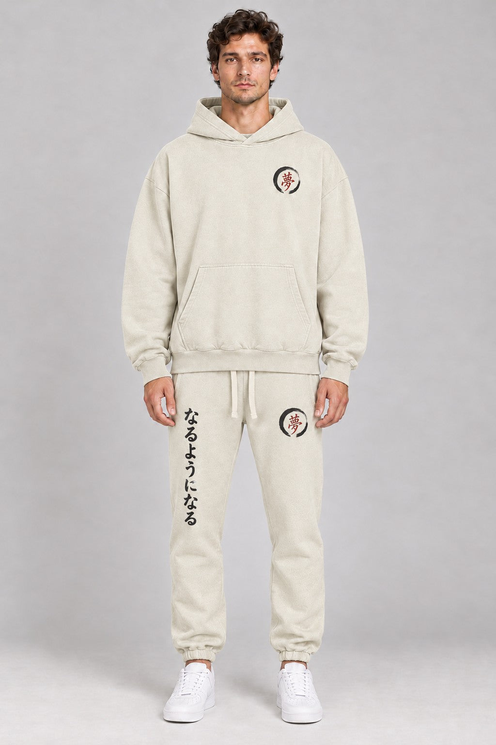 Model wearing the Things Become cream hoodie with matching cream joggers, front