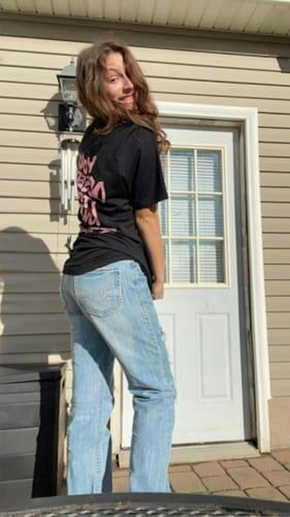 Customer in You Deserve To Be Loved black tee with oversized fit, outdoor porch